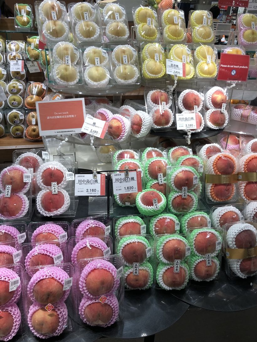 A two-pack of some incredibly large white peaches.